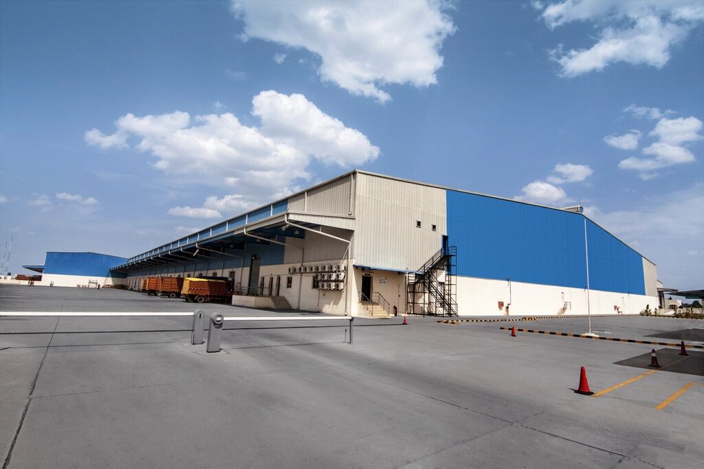 Large industrial warehouse with blue cladding